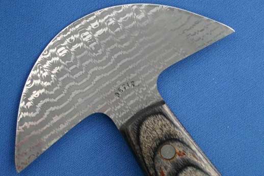 Sharkstooth damascus head knife for cutting leather. 