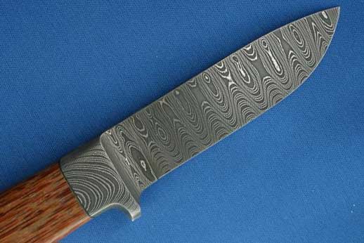 A ladder pattern stainless damascus hunting knife. 