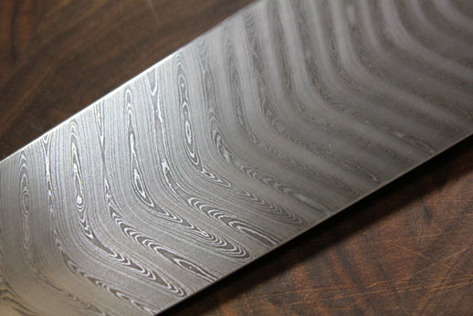 Closeup of 270mm Gyuto blade in Chevron double carbon.